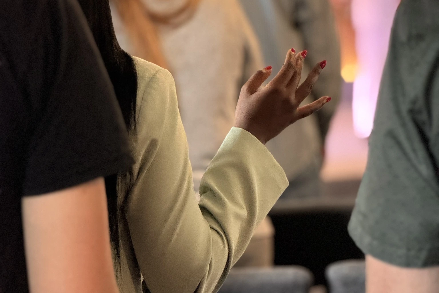 A worshiper raising a hand during a church service